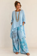 Fiorella | Conjunto floral de blusa asimétrica y pantalón de pierna ancha